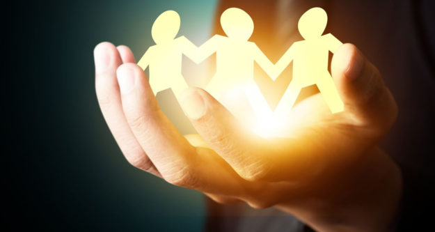 21427529 – paper family in hand, insurance concept